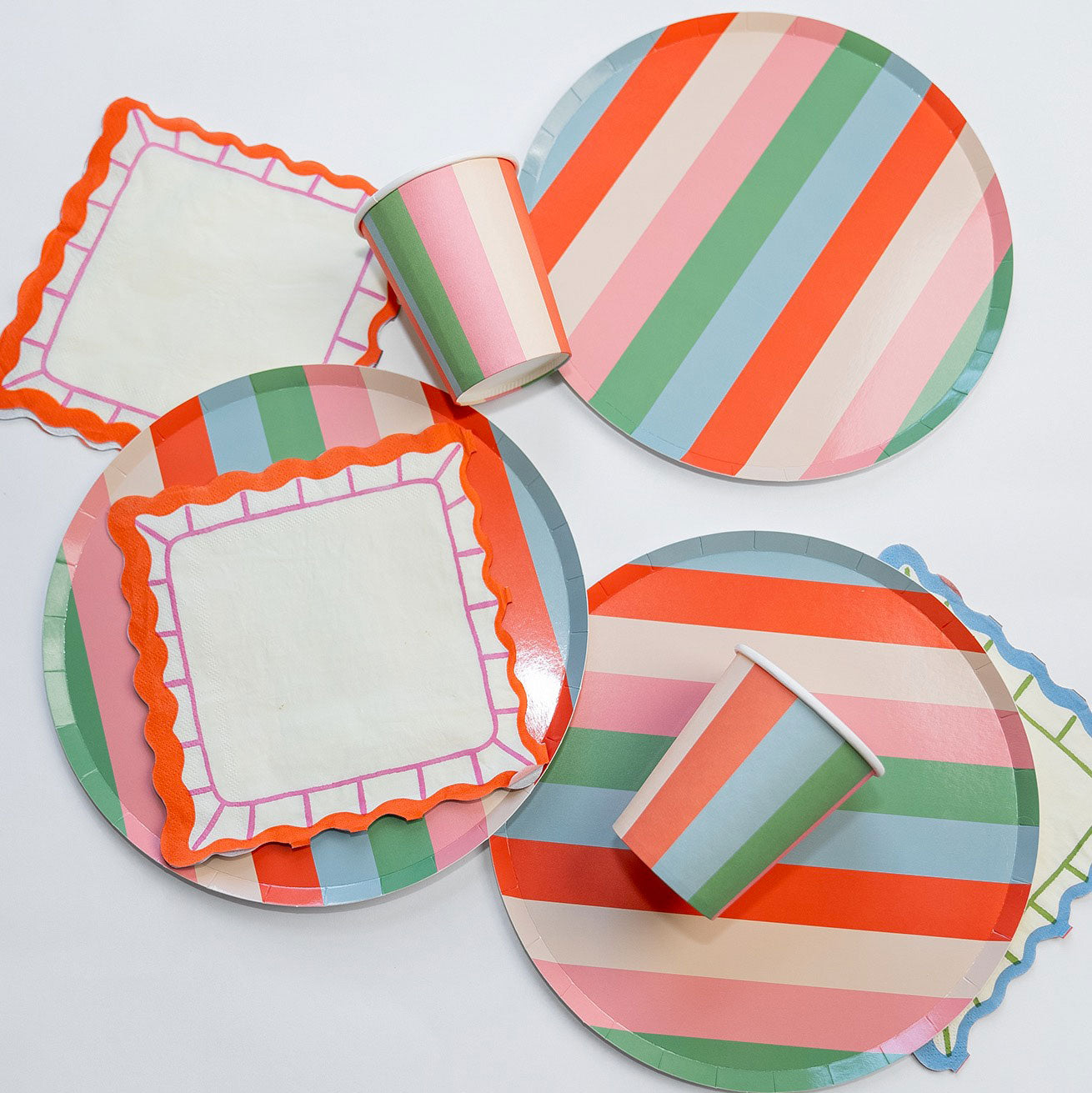 Vibrant Striped Party Pack with plates, cups, and napkins for 12 guests in retro colors