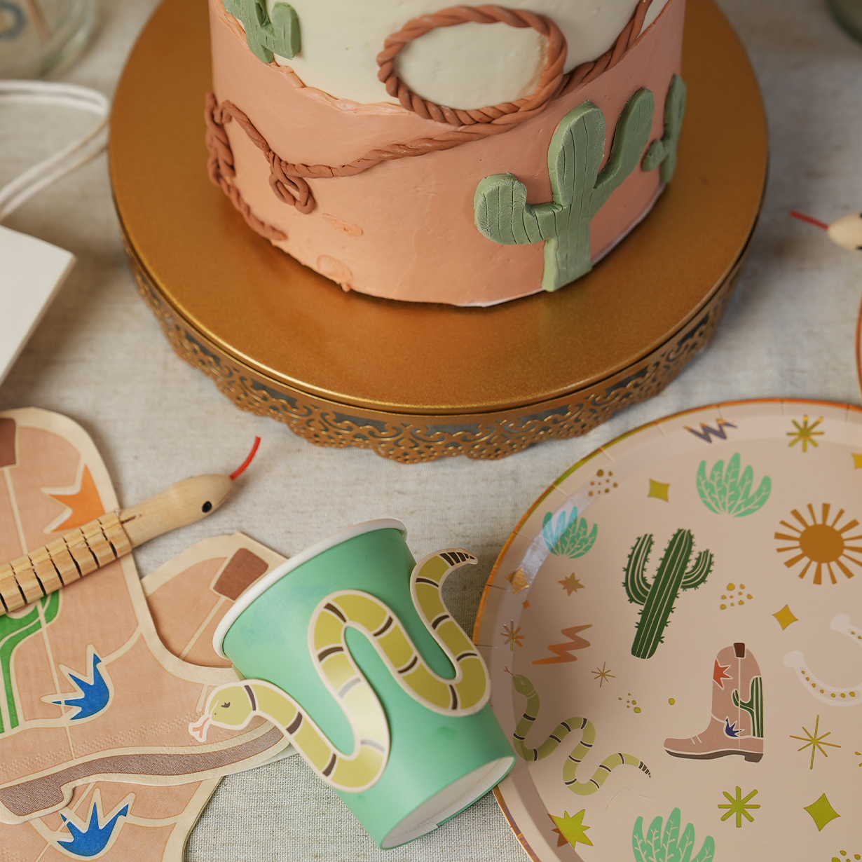 Western boot-shaped disposable party napkins in a 12 pack for cowboy-themed events