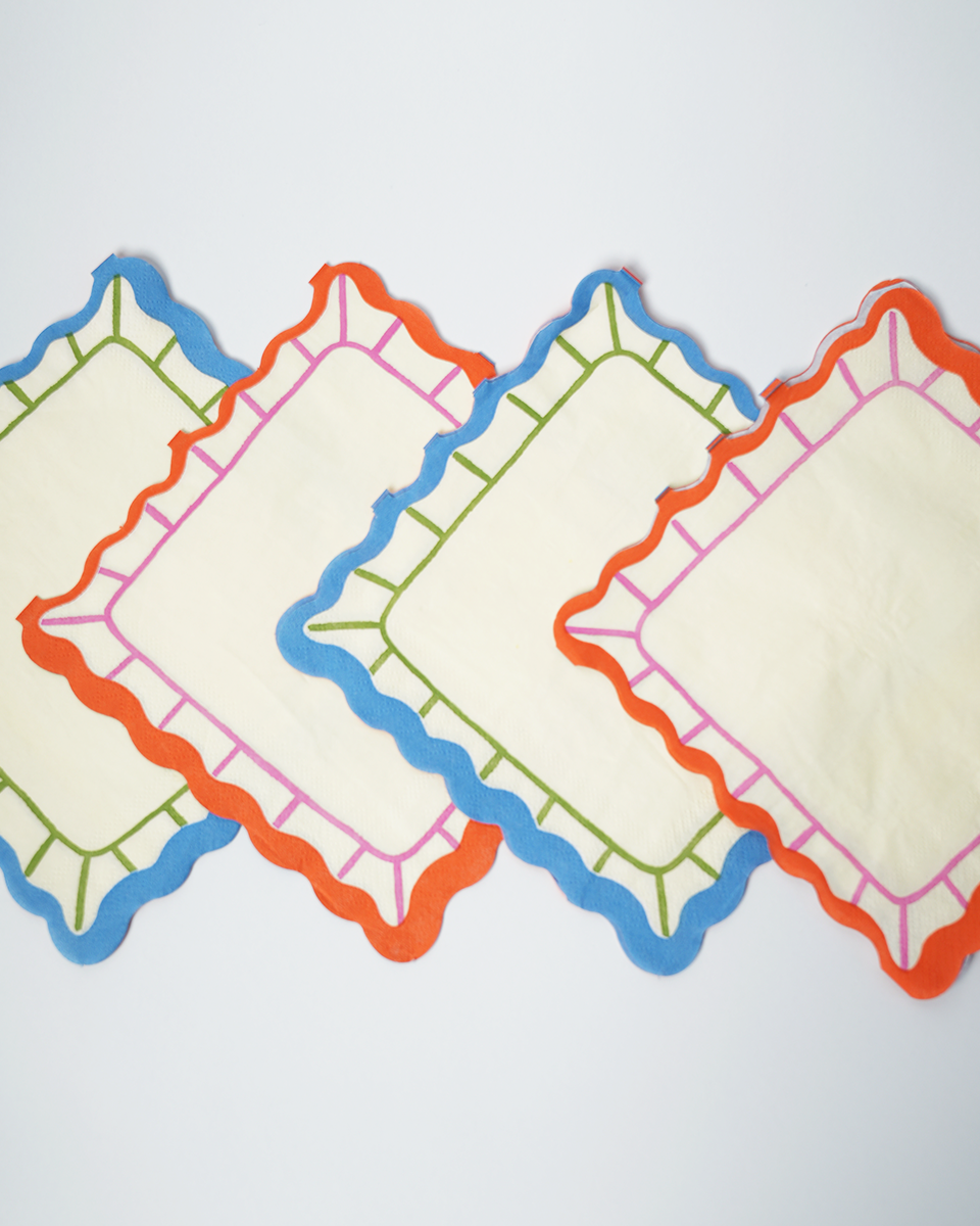 Art Party Napkins with bright scalloped edges in blue, orange, and green colors