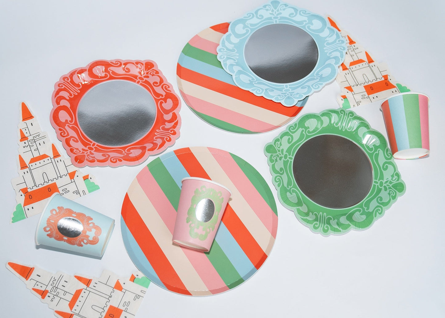 Royal princess theme party pack with striped plates, decorative mirroring plates, paper cups, and castle-shaped tableware pieces in pink, green, blue, and orange colors.