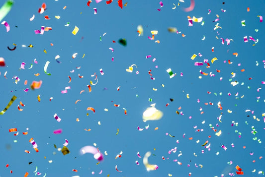 colorful confetti against blue sky