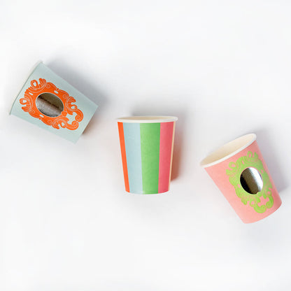 Set of three princess party cups featuring mirror and striped designs with colorful accents on a white background